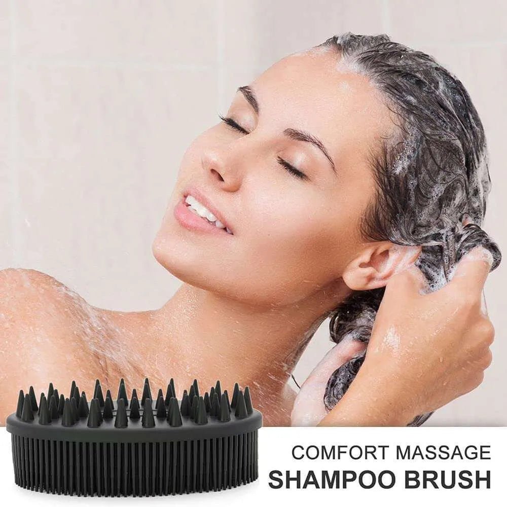 Woman washing her hair with a comfort silicone bath brush on a light background