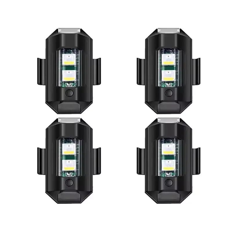 Four black clip-on lights on a white background