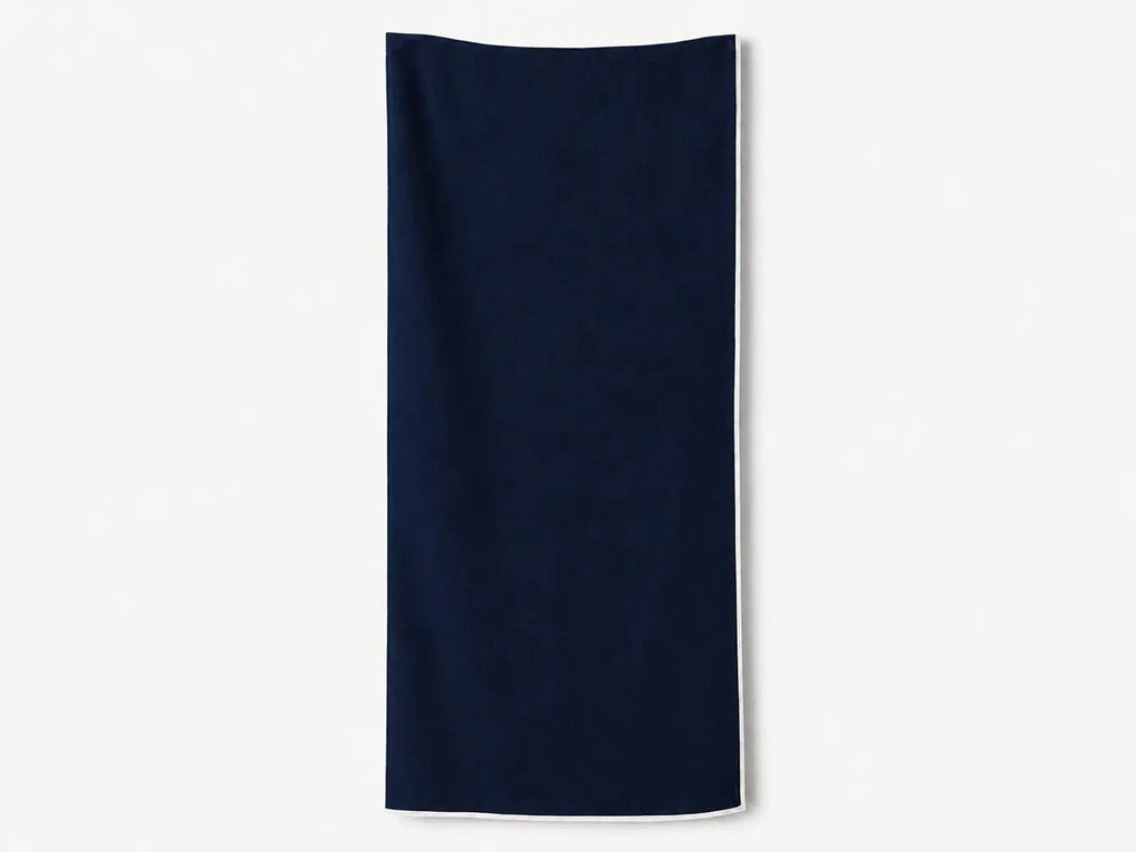 Navy blue towel on a white background