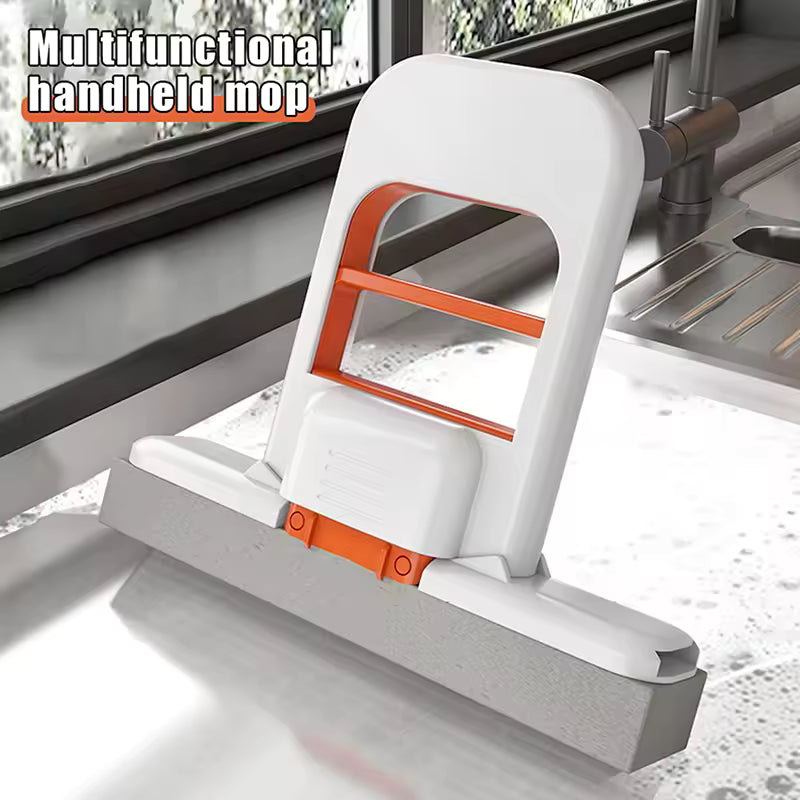 Multifunctional handheld mini mop with orange accents on a kitchen counter.