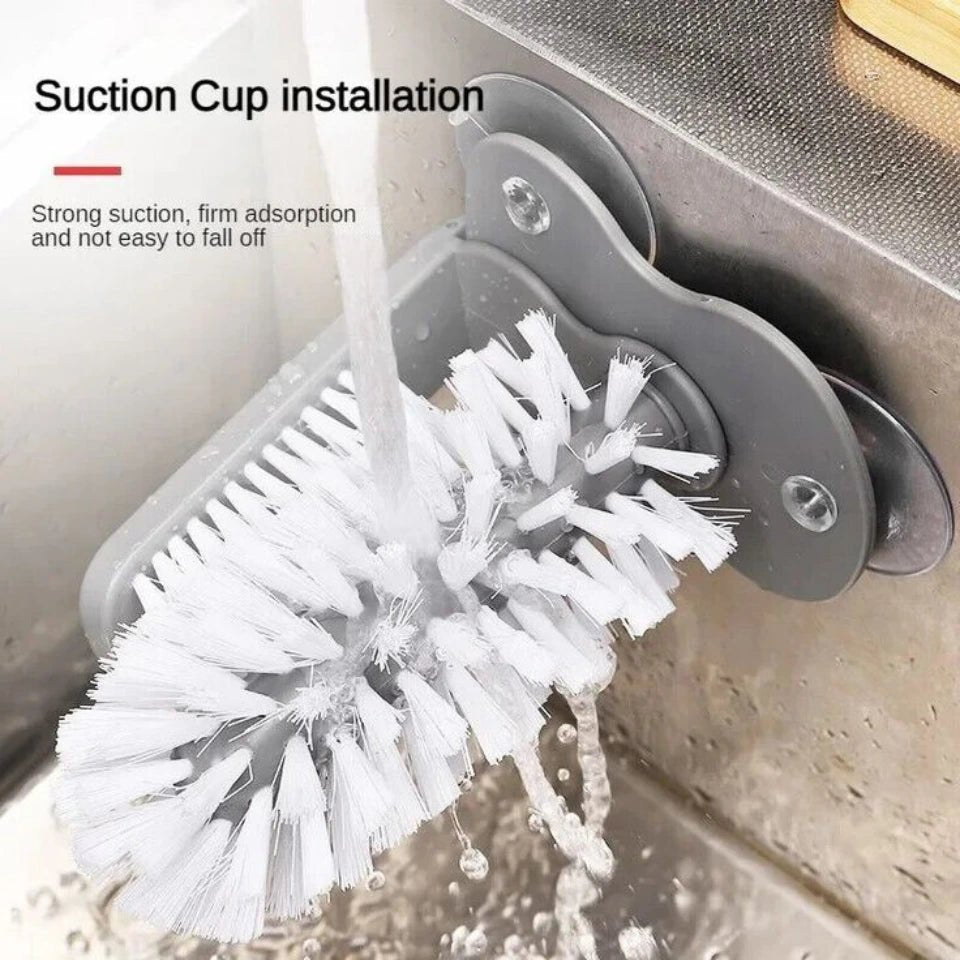 Cleaning brush with suction cup installation on a sink